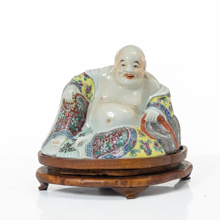 A Chinese famille rose porcelain figure of a Budai, around 1900.