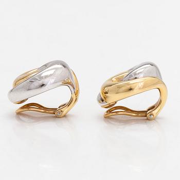 A pair of 18K white and yellow gold earrings.