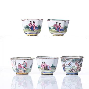 A set of five enamel on copper tea cups and a dish, Qing dynasty, circa 1800.