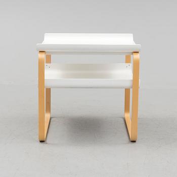 An occational table model 915 by Alvar Aalto for Artek.