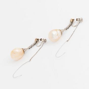 A pair of 18K gold and pearl earrings set with old- and rose-cut diamonds.