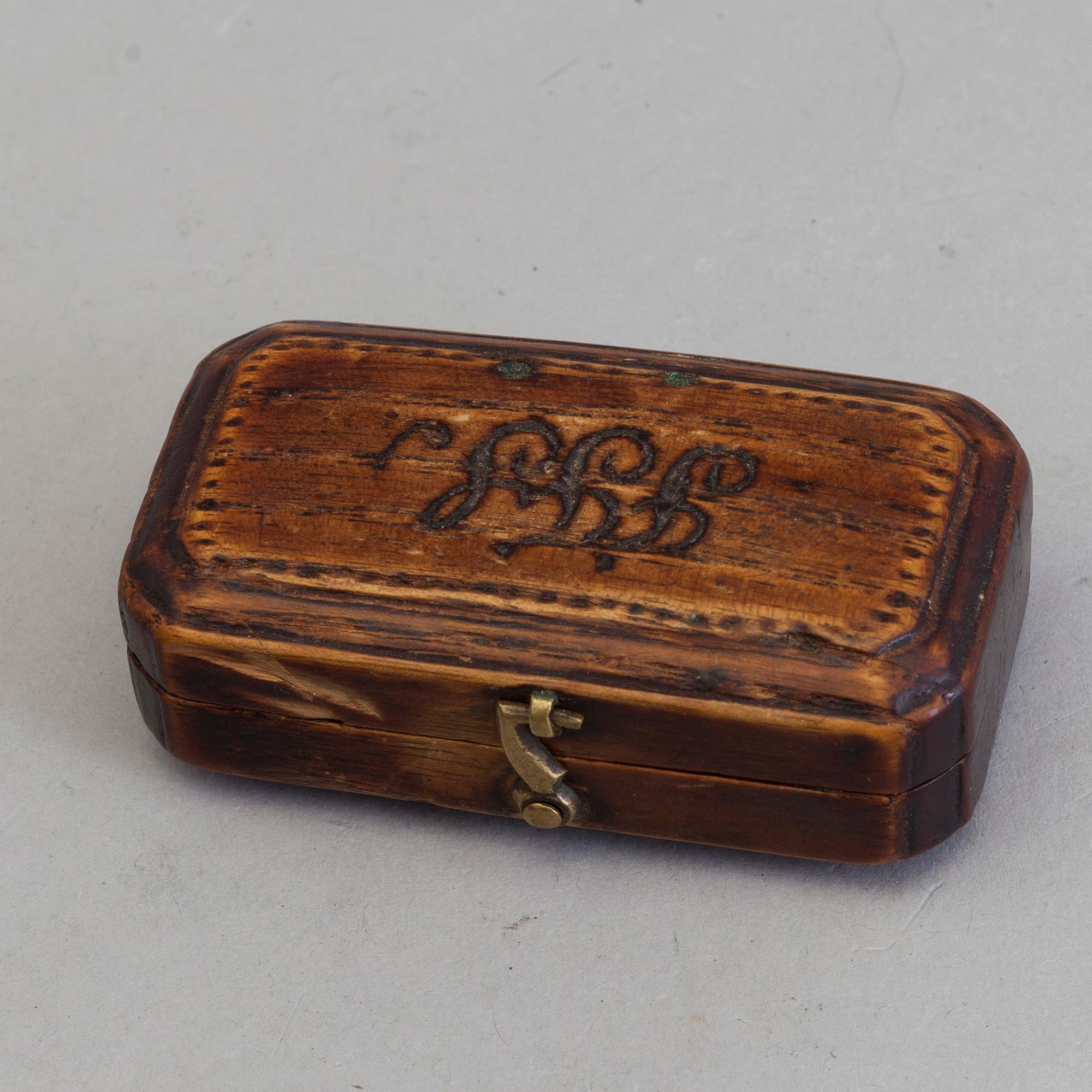 A brass and iron phleam dated 19th century.
