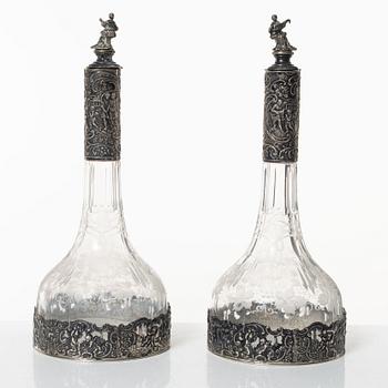 A pair of glass decanters with silver mounts, Swedish import marks, CG Hallberg, early 20th Century.