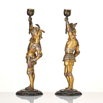 A pair of presumably German knights candlesticks, secound half 19th century.