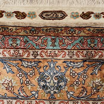 A carpet, an old silk Turkey, ca 237,5 x 146,5  cm (as well as 3,5-4 cm flat weave at the ends).