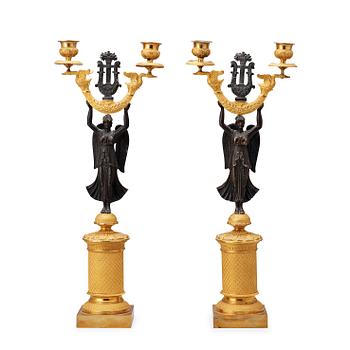 1441. A pair of French Empire early 19th century candlesticks.