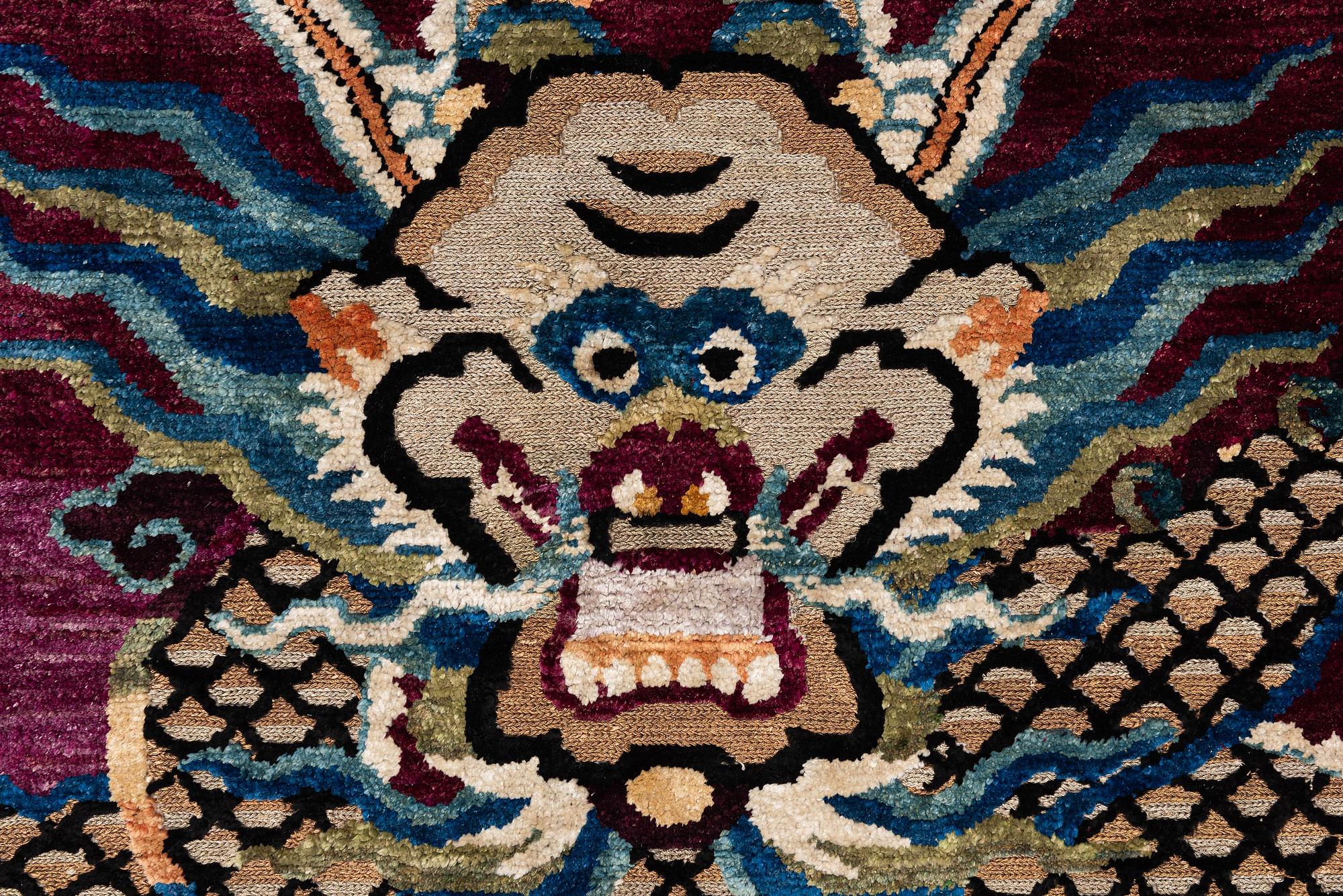 A Chinese silk and metal-thread 'Dragon' pillar rug, Bejing, North China, around 1910, c. 234x151 cm.
