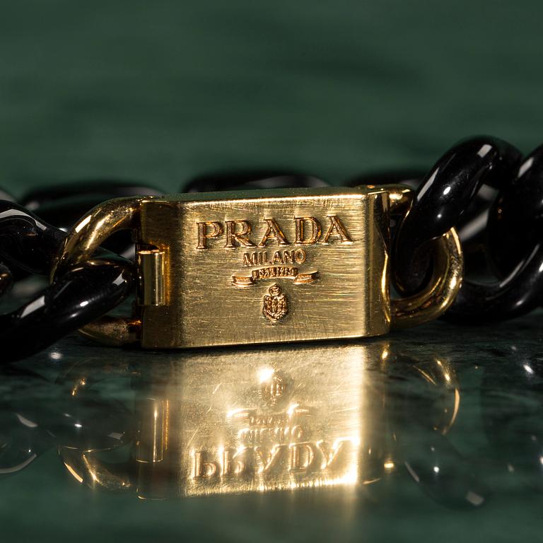 A necklace by PRADA.