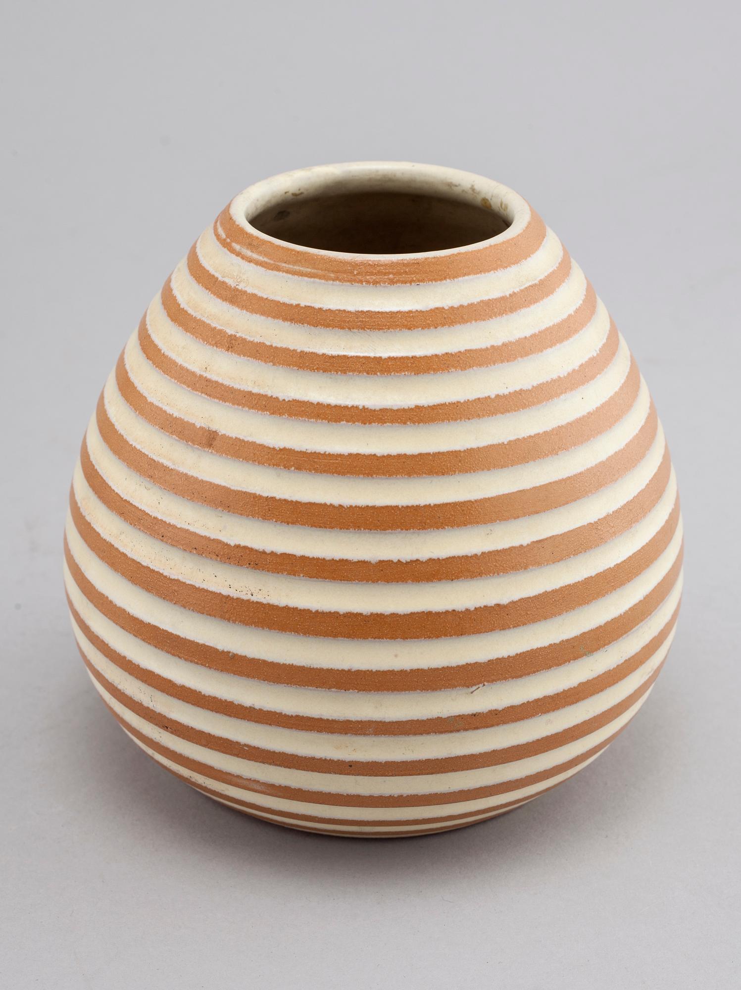 Three vases and on Upsala Ekeby, mid 20th century.