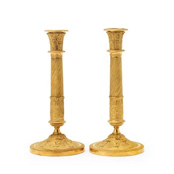 A pair of French Empire early 19th century candlesticks.