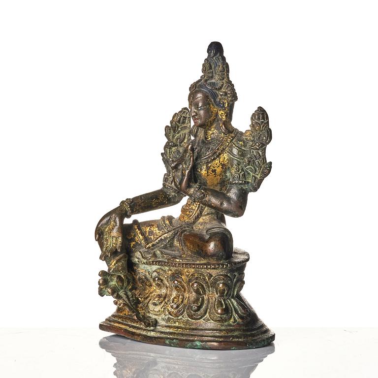 A copper alloy figure of Green Tara, Tibet, 17/18th century or later.