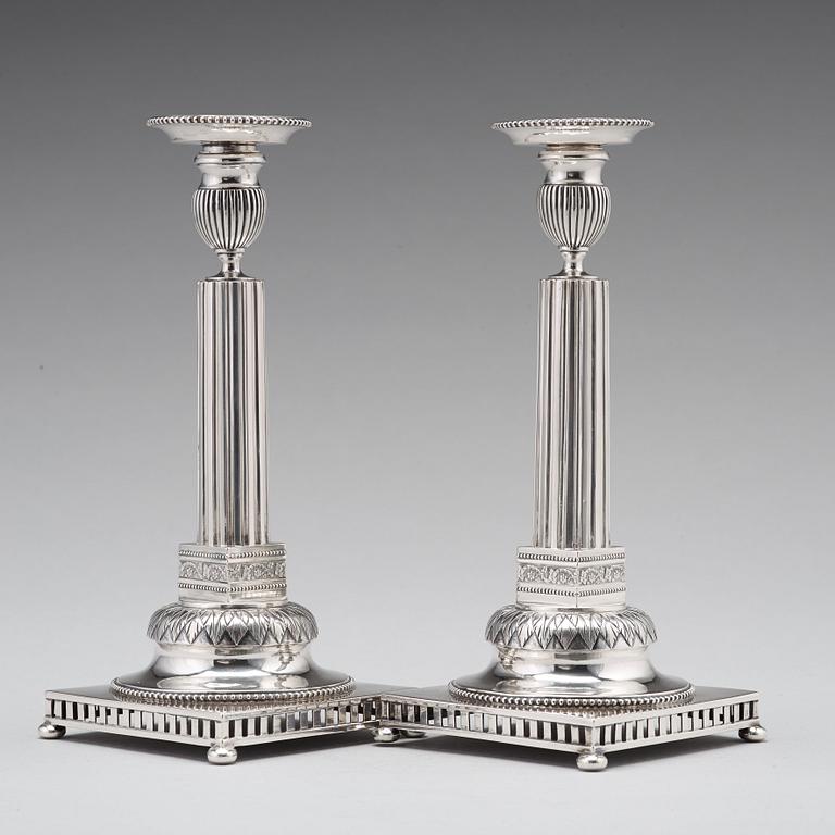 A pair of Swedish 18th century silver candlesticks, Stephan Westerstråhle, Stockholm 1793, one nozzle J E Torsk 1895.