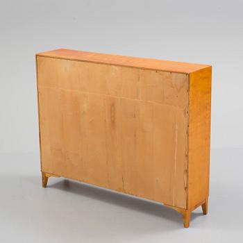 A mid 20th century birch veneered shelf.