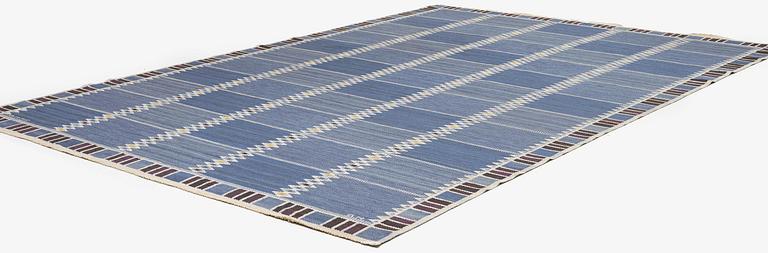 Barbro Nilsson, a carpet, 'Salerno blå med enkel bård', flat weave, c. 365 x 244 cm, signed AB MMF BN.