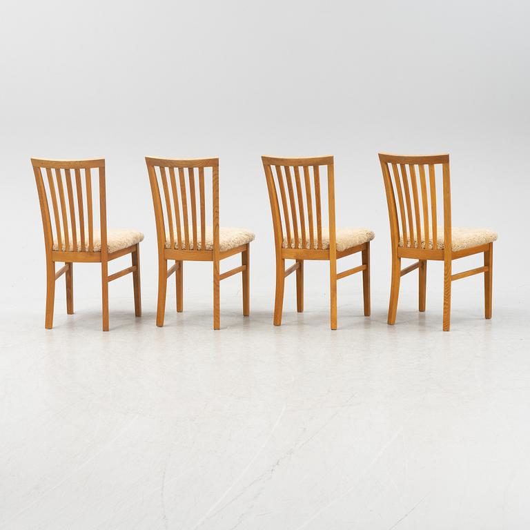 A set of four oak chairs with new  sheepskin upholstery.