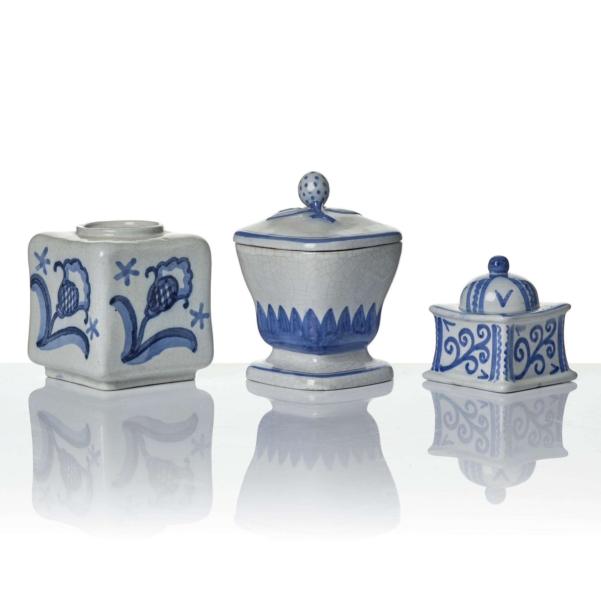 Wilhelm Kåge, eleven pieces of faience including jars, inkwells and a tulip vase, Gustavsberg, Sweden, 1919-1920.