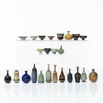 A set of fourteen stoneware vases and ten bowls, predominantly John Andersson, Höganäs.