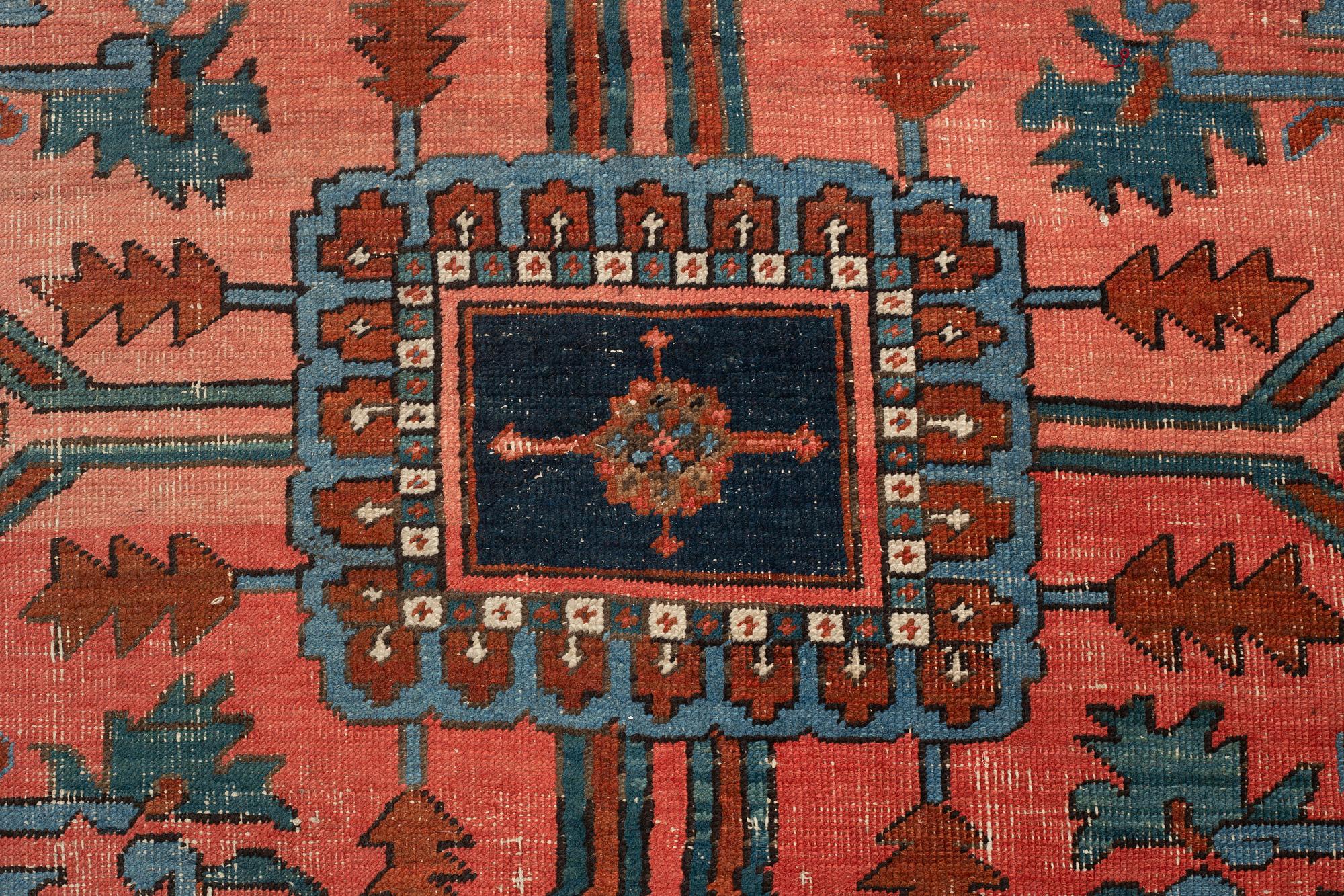 An antique Heriz Serapi carpet, West Persia, c. 616 x 407 cm.