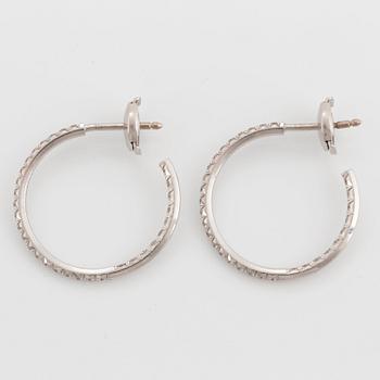 A pair of Tiffany "Metro" 18K white gold hoops set with round brilliant-cut diamonds.