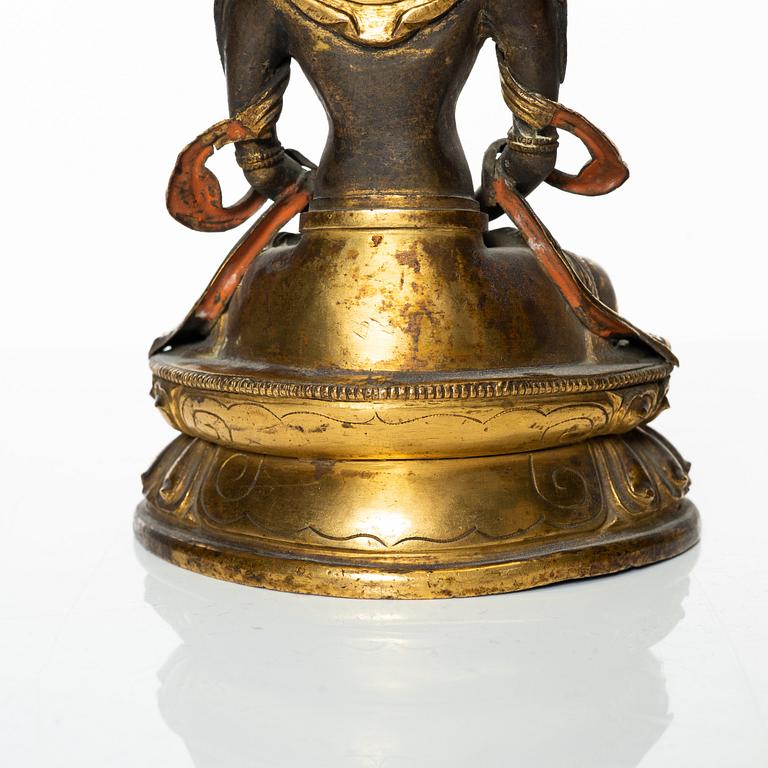 A gilt copper figure of Amitayus, Tibeto-Chinese, 18th Century.