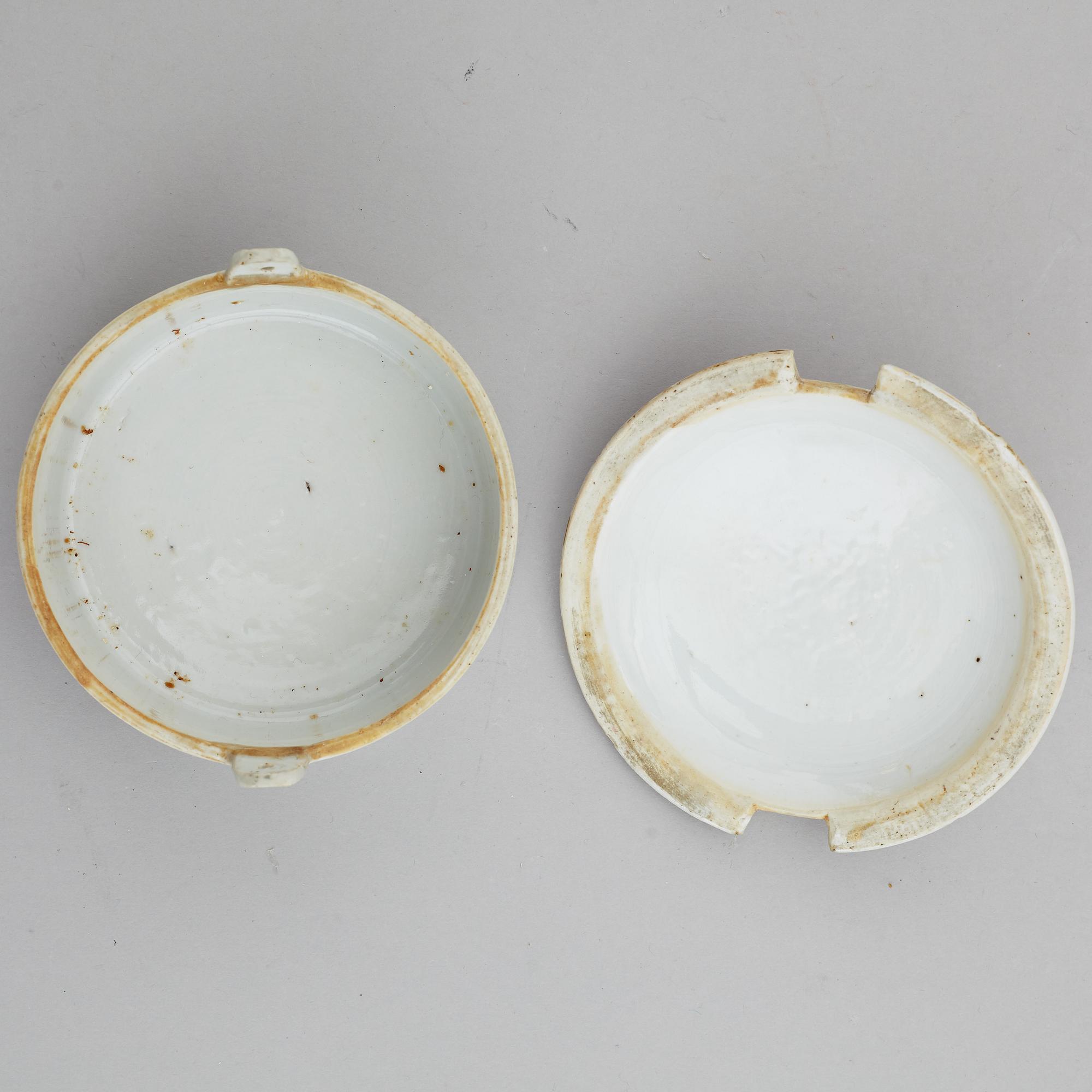 A famille rose butter tureen with cover and two cups with three odd stands, Qing dynasty, Qianlong (1736-95).