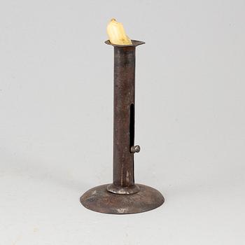 An 18th century tinplate candlestick.