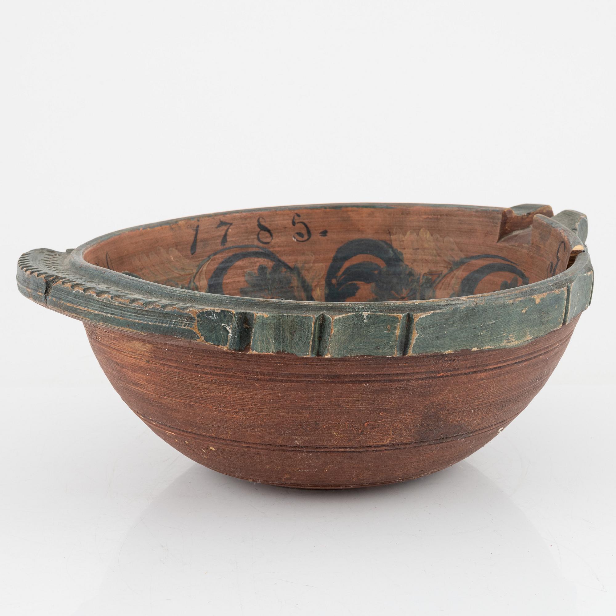 A lathed and painted bowl dated 1783.