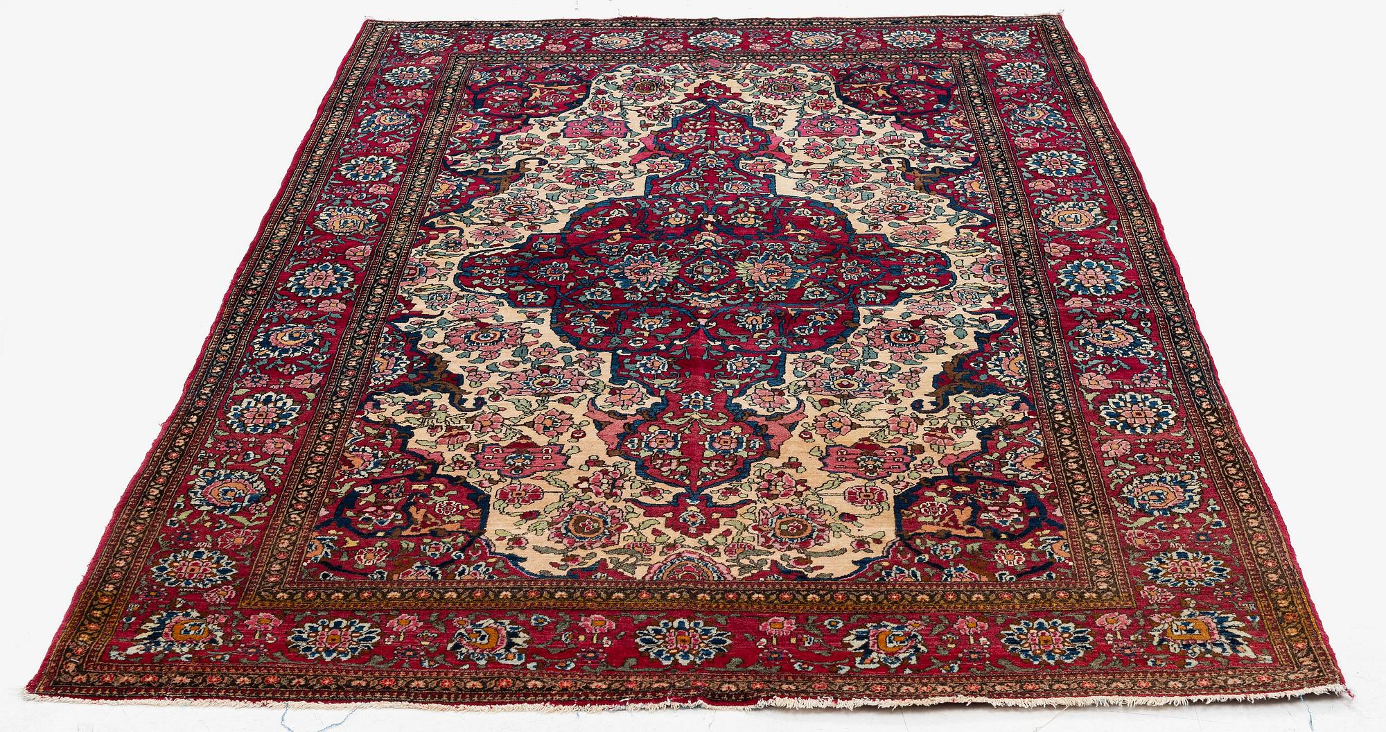 An antique Isfahan rug, Central Persia, c 234 x 146 cm.