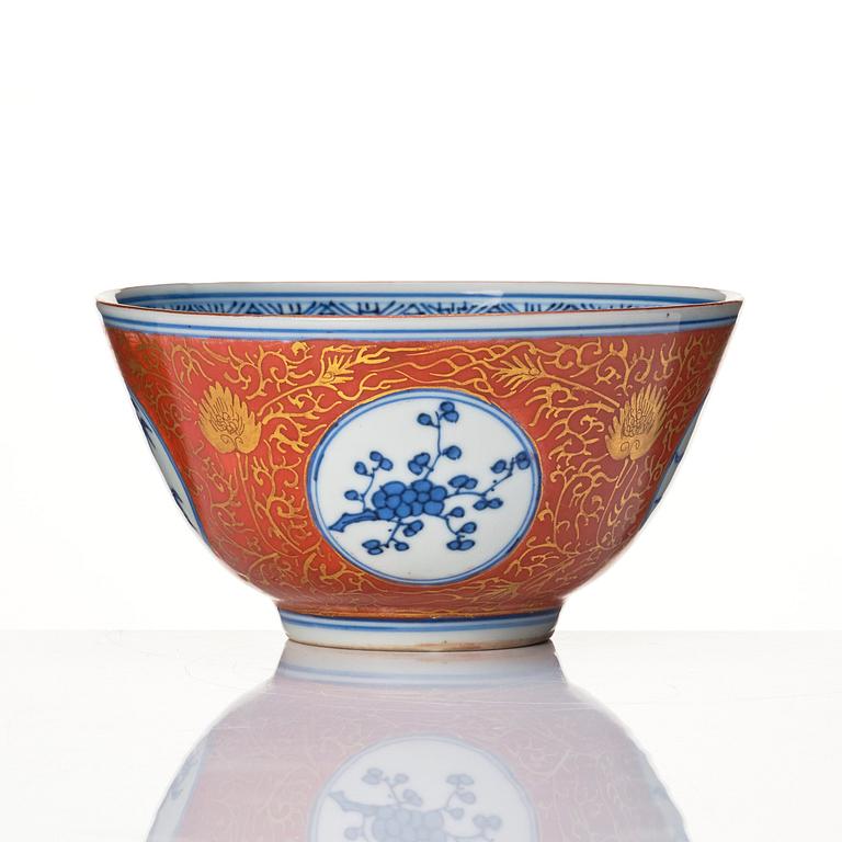 A blue and white bowl with coral red exterior, Japan, 19th century.