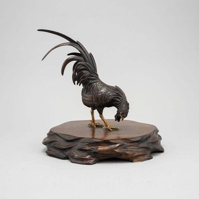 A Japanese bronze sculpture or okimono in the shape of a rooster, Meiji (1868-1912).