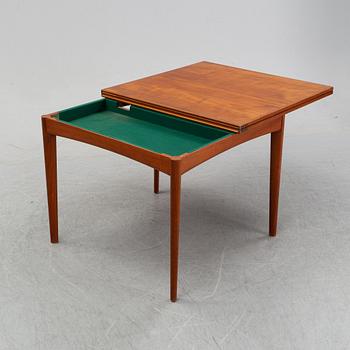 A teak dining group, table and six chairs model no. 49, designed by Erik Buch, Denmark, in 1949.