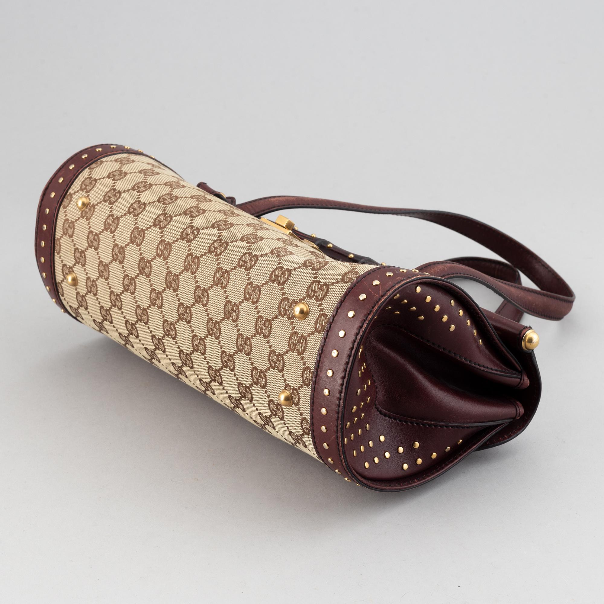 Gucci, a monogram canvas bag.