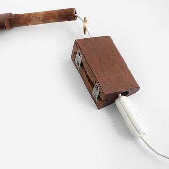 A 1950-60s teak and glass wall light.