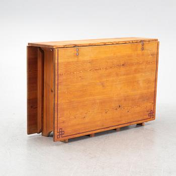 A gate-leg table, around 1900.