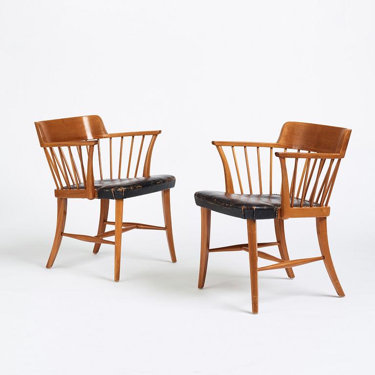 Josef Frank, a pair of mahogany and black leather 'Captain's chair', Svenskt Tenn, model 789B, acquired in 1950.