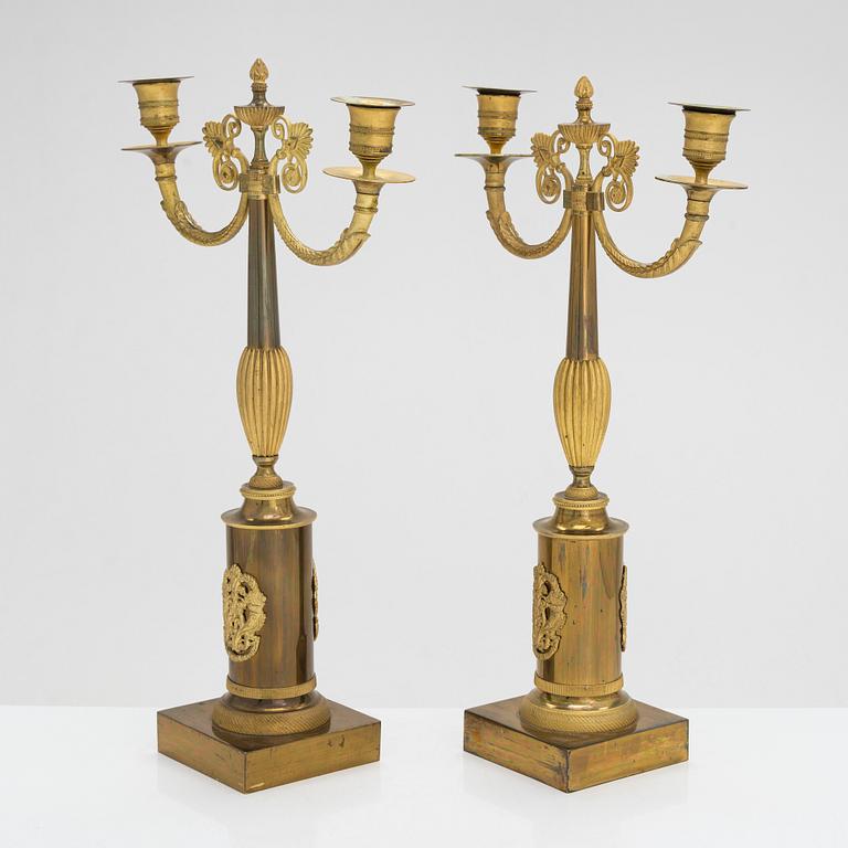 A pair of brass candelabra, early 20th century.