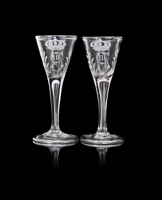 A pair of Swedish wine glasses with the crowned monogram of King Gustavus III, 18th Century.