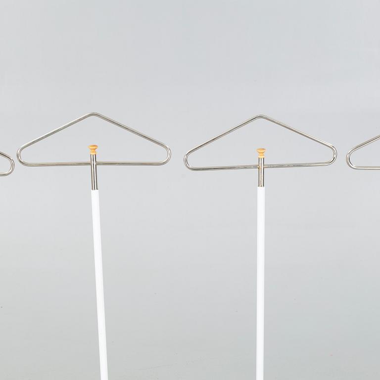 Four late 20th cenutry coat hangers.