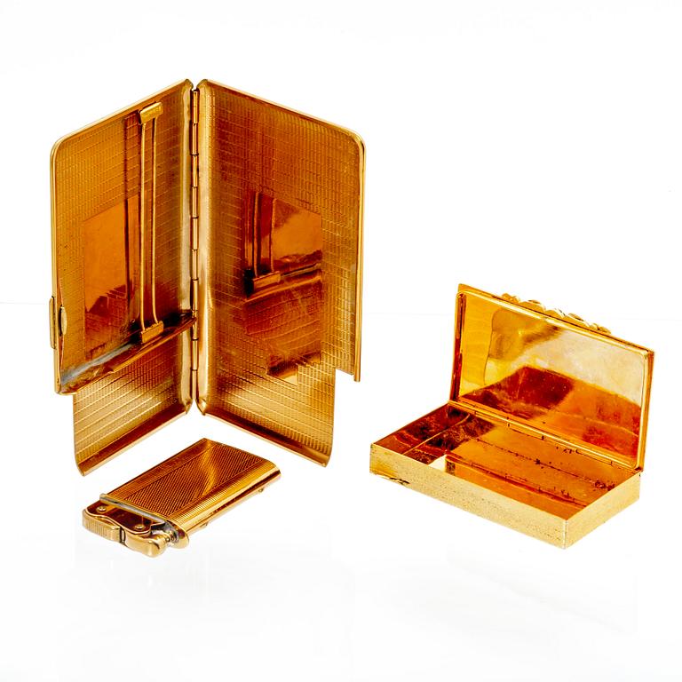 A set of three 20th century gold metal cigaret cases.