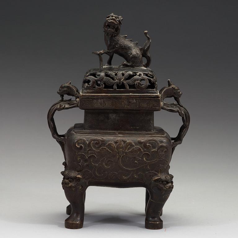 A Chinese bronze incense burner with pierced cover, Qing dynasty, 17th/18th century.