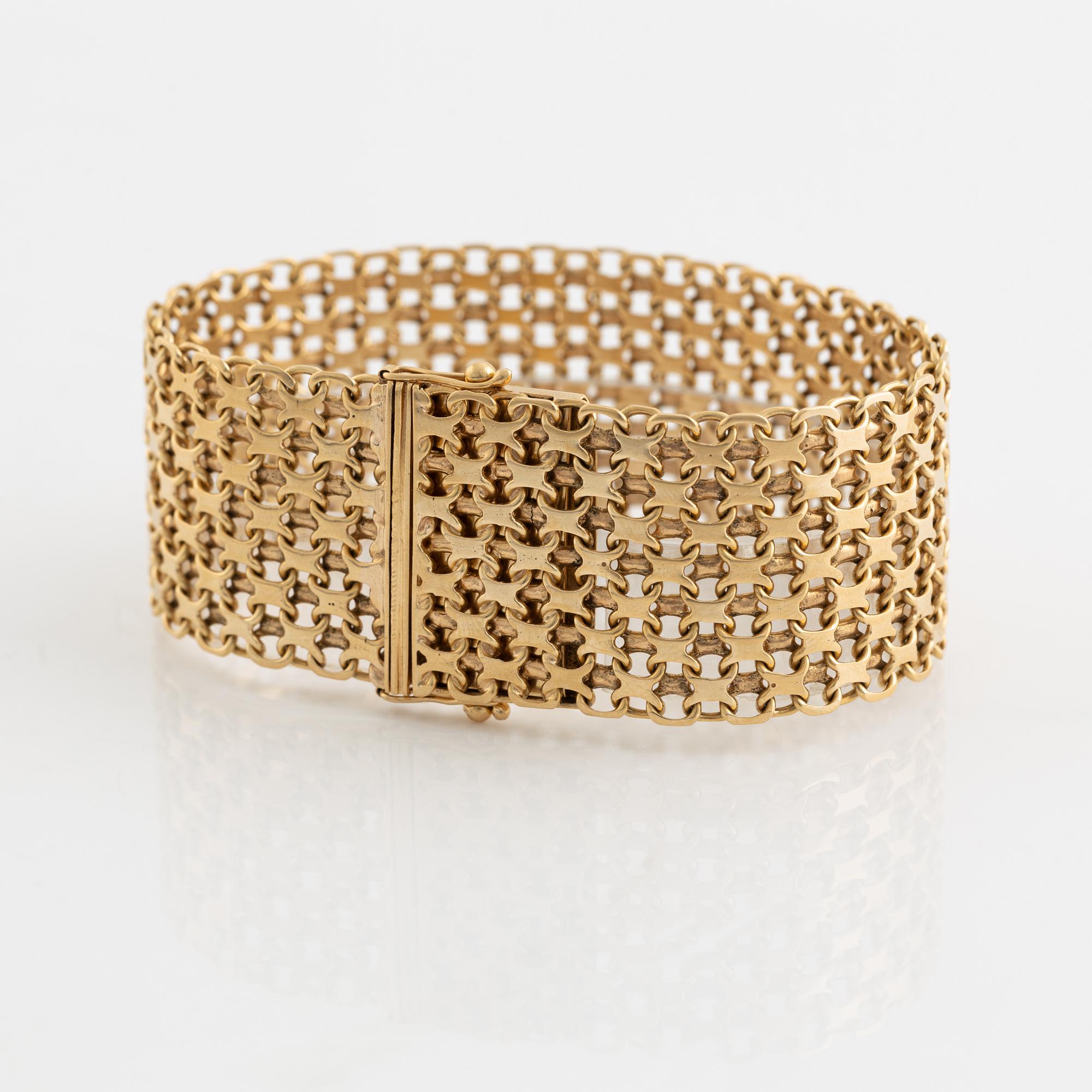 An 18K gold bracelet.