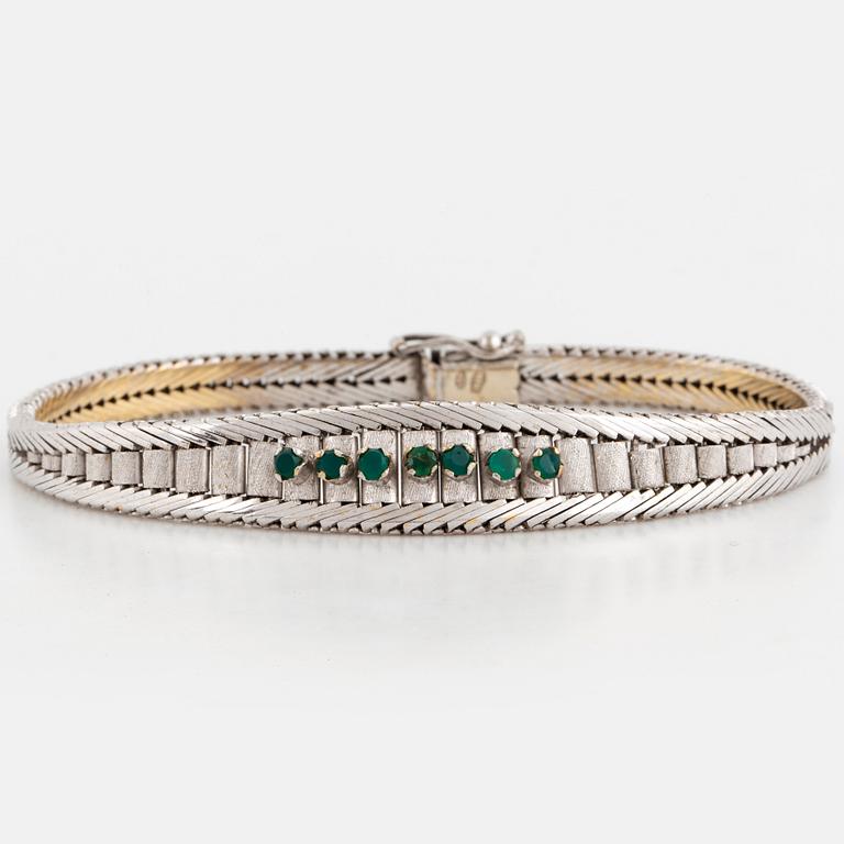 Bracelet with emeralds.