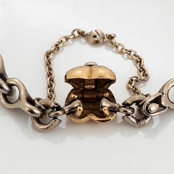 An Ole Lynggaard bracelet with a detachable clasp in 14K white gold and gold.
