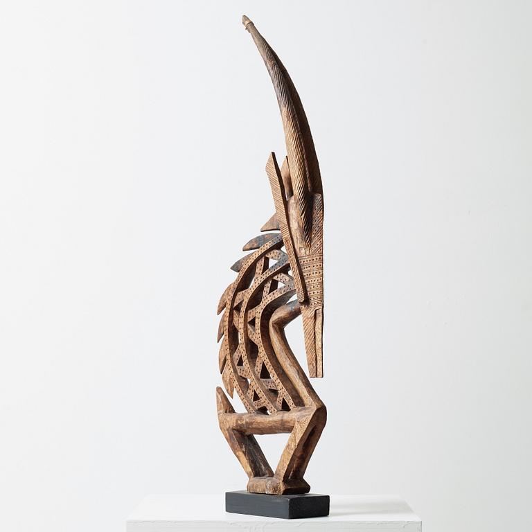 HEADDRESS Tshiwara/Ciwara (stylized male antelope). Wooden sculpture.