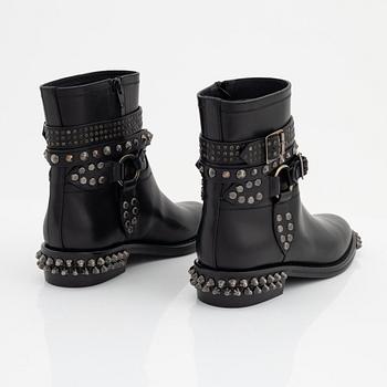 Yves Saint Laurent, a pair of black leather and studs boots, size 38.