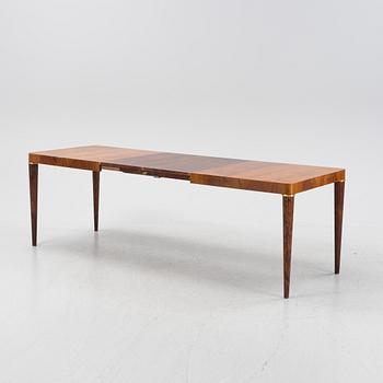 A Swedish Modern mahogany dining table, mid 20th Century.