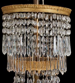 An Empire first half 19th century eighteen-light gilt bronze chandelier.