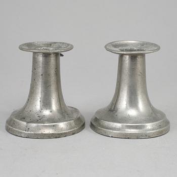 A pair of 19th century pewter candlesticks.