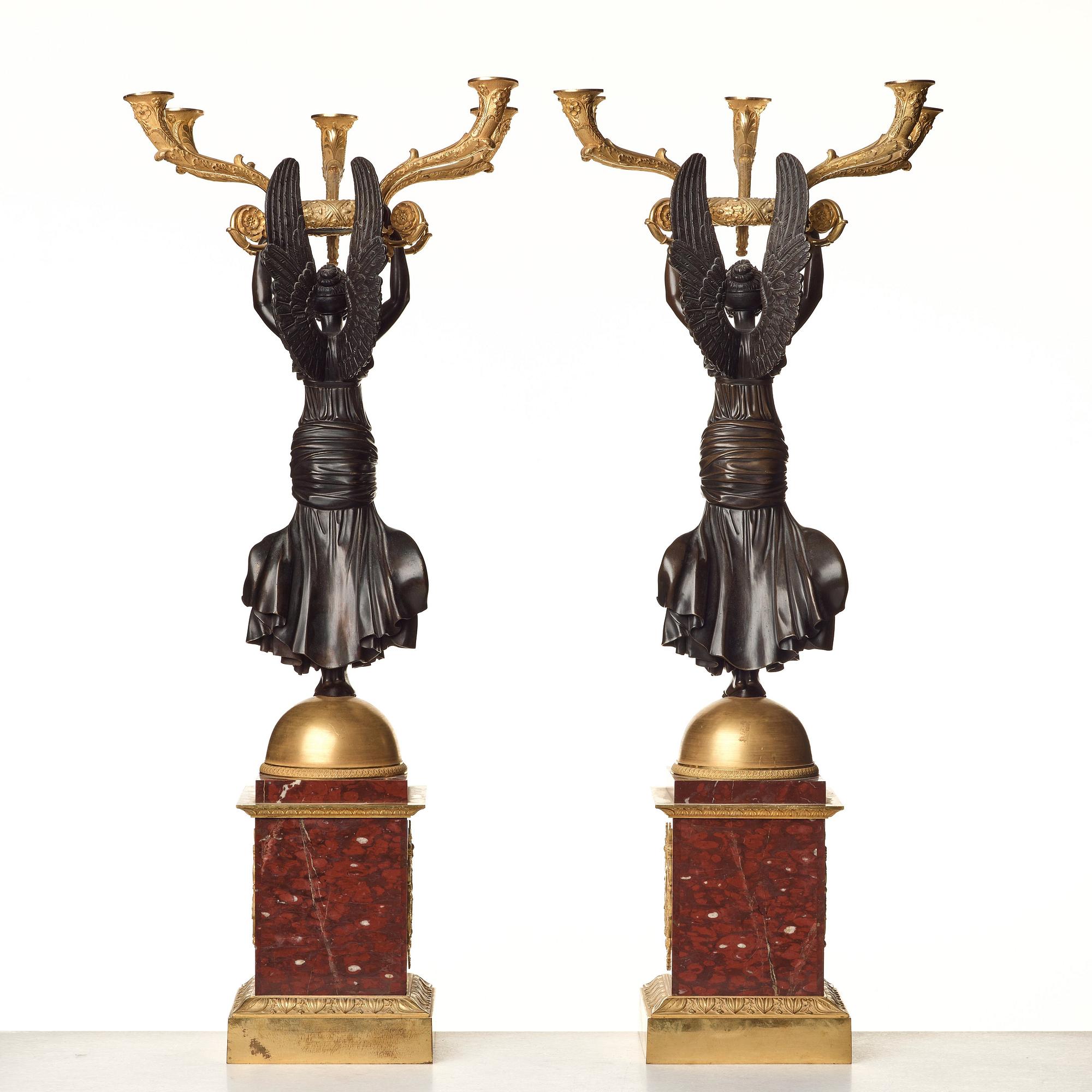 A pair of important five light Empire candelabra.
