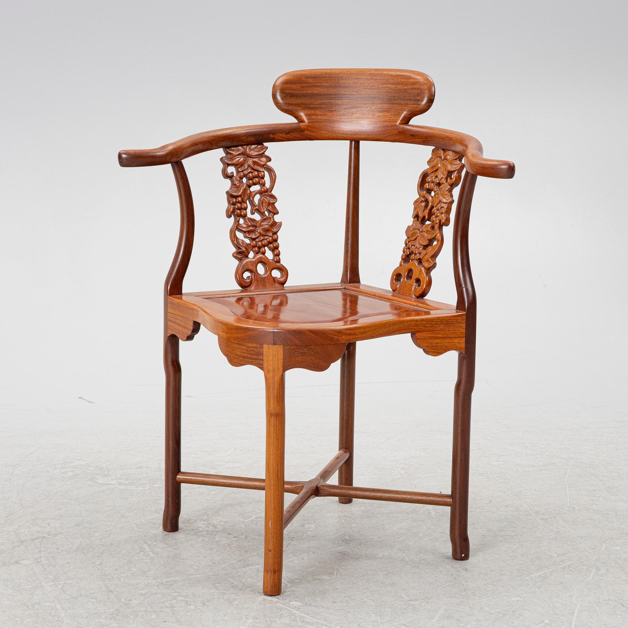 A Chinese hardwood corner armchair, 1900s.